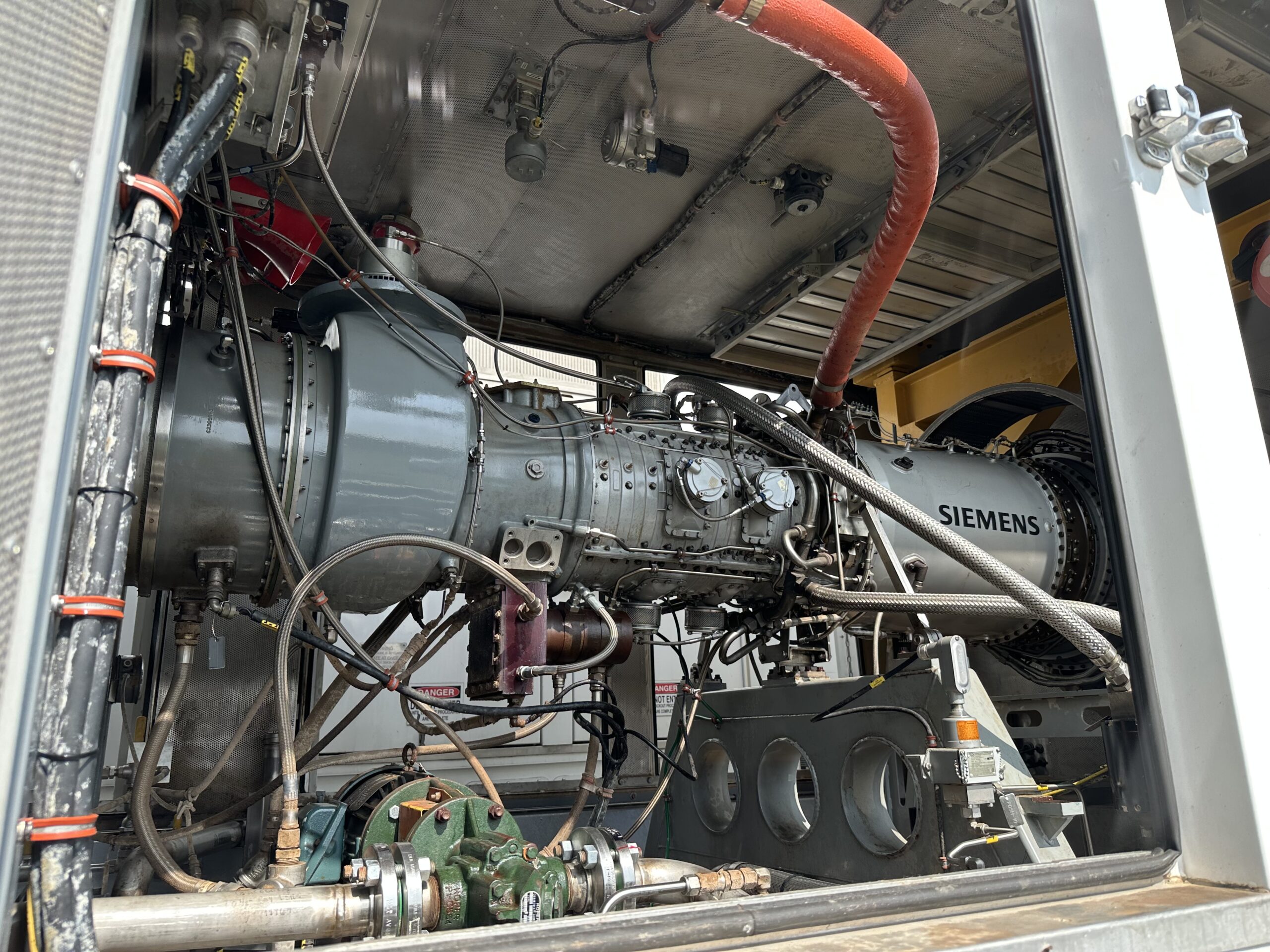 Gas turbine skid interior showing rotor, casing, and piping detail