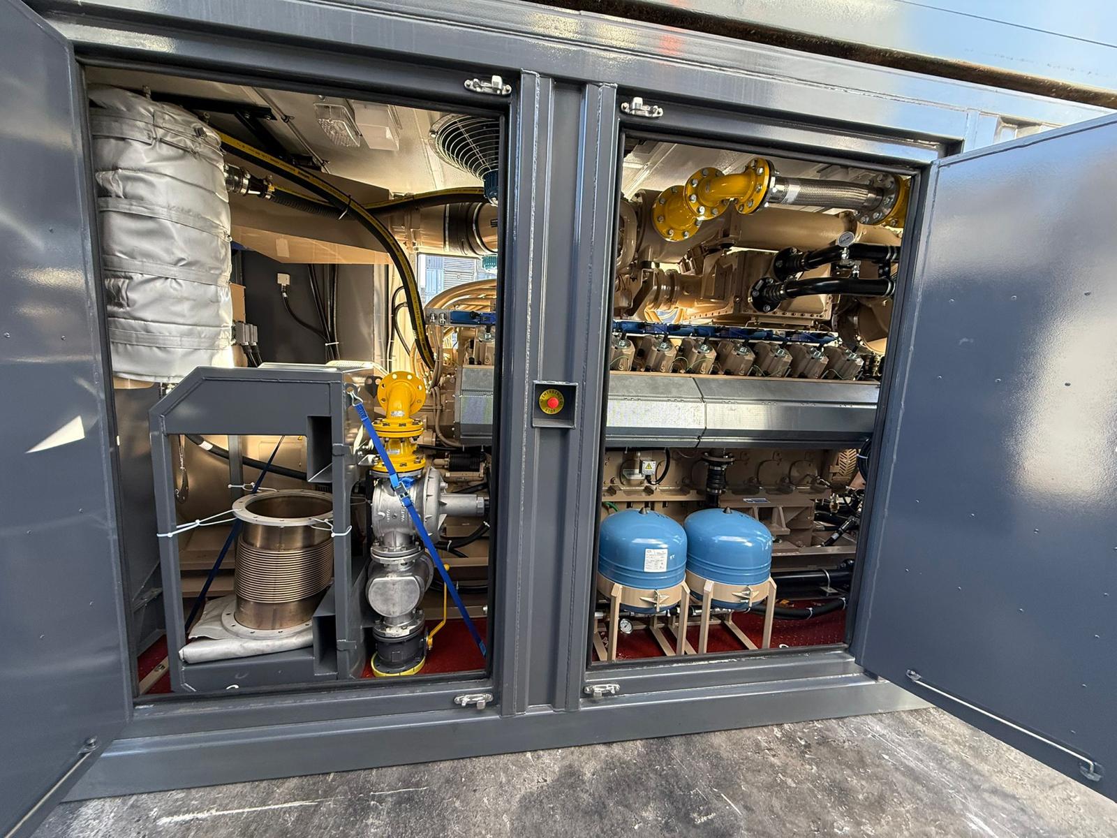 Containerized gas engine genset with open enclosure doors showing engine and auxiliary skid